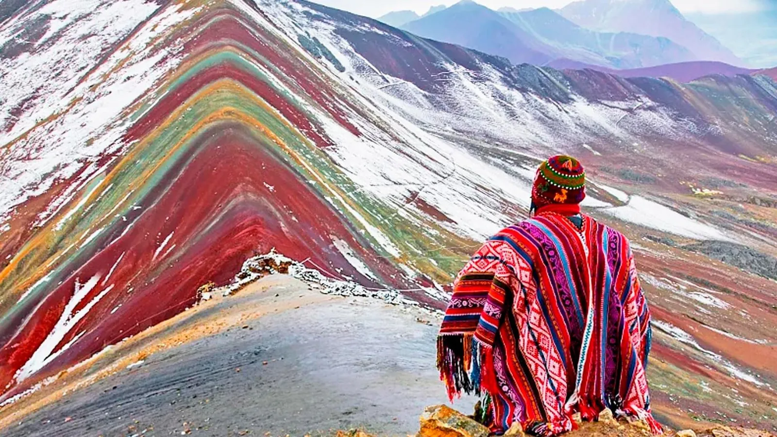 Trekkers on the summit ridge of Vinicunca