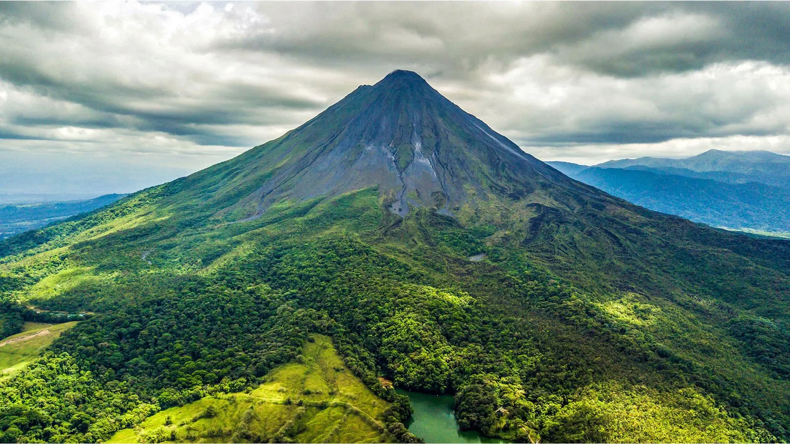 The Arenal volcano surrounded by rainforest